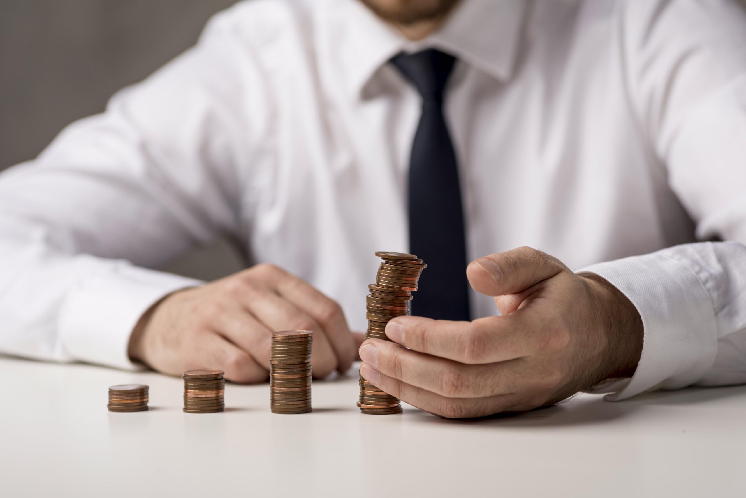 front-view-businessman-with-coins